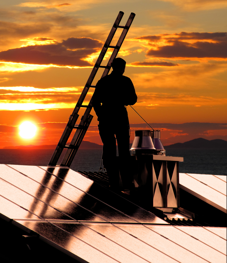 Chimney professional at work on a rooftop in Western Massachusetts
